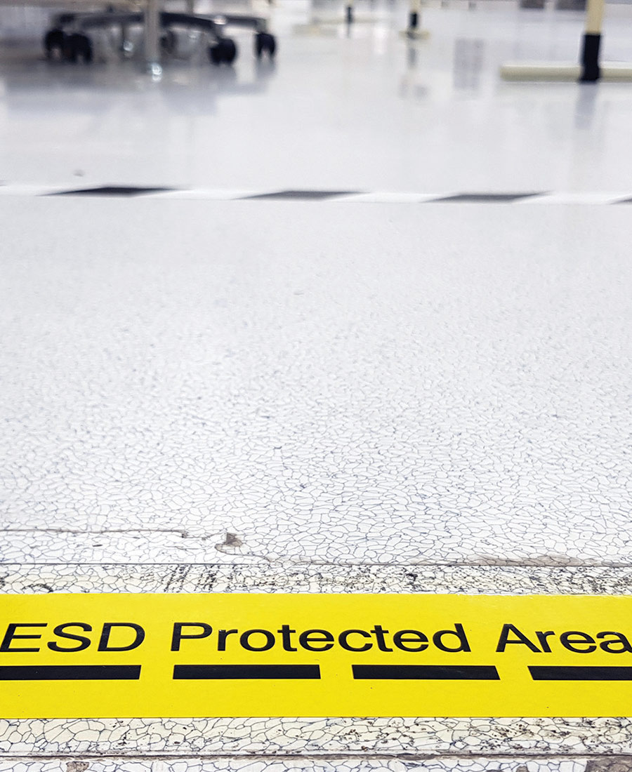 "ESD Protected Area" banner on rain-slicked street