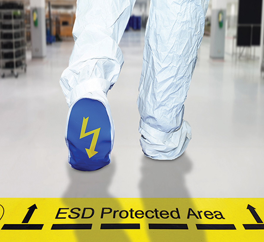 person walking in a protection suit in a lab
