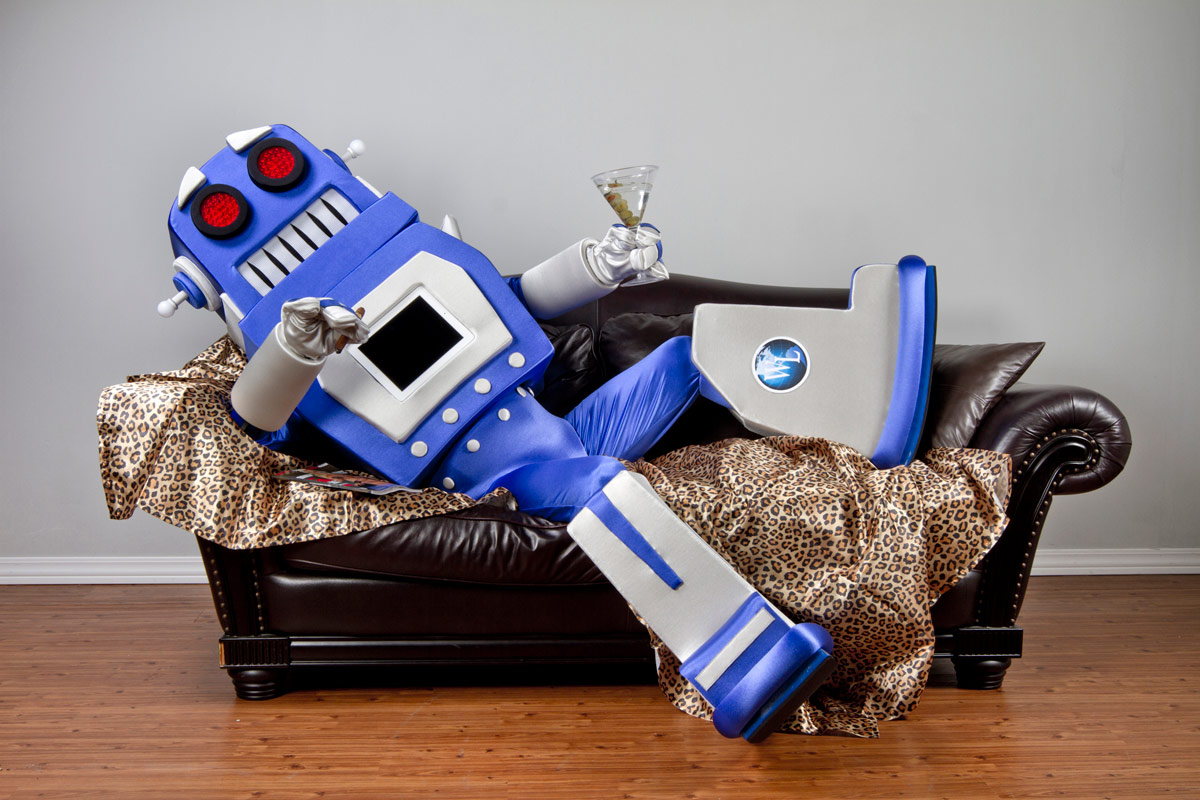 robot sitting on the couch drinking a martini