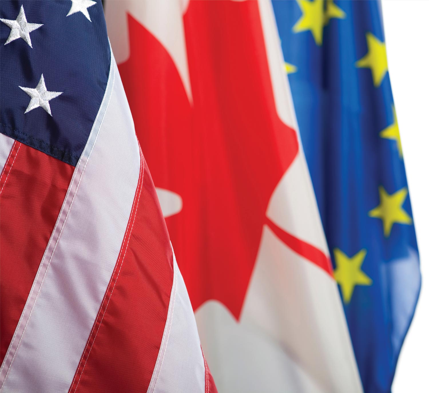 close view of the U.S., Canadian and European flags