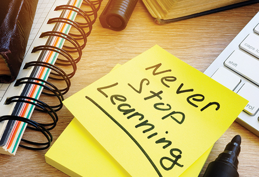 sticky note with Never Stop Learning written on it