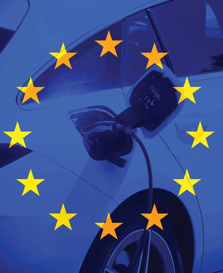 transparent flag of Europe with a close up on electrical car charging behind it