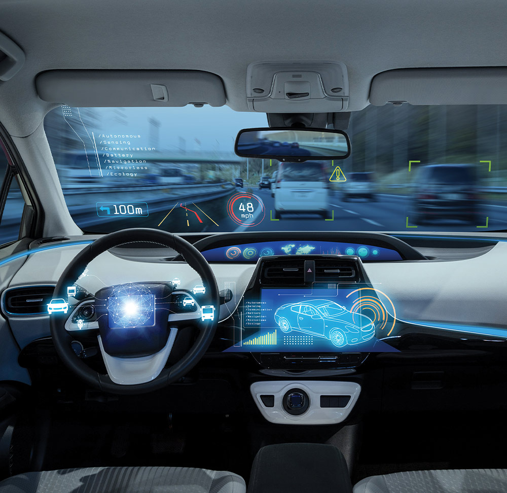 internal view of a car with holographic interfaces on the steering wheel, front windshield and dashboard center console