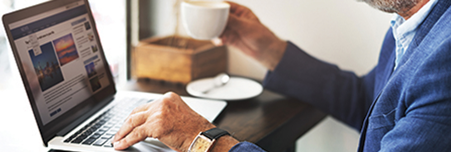 Product Marketplace man sitting at a desk using a laptop