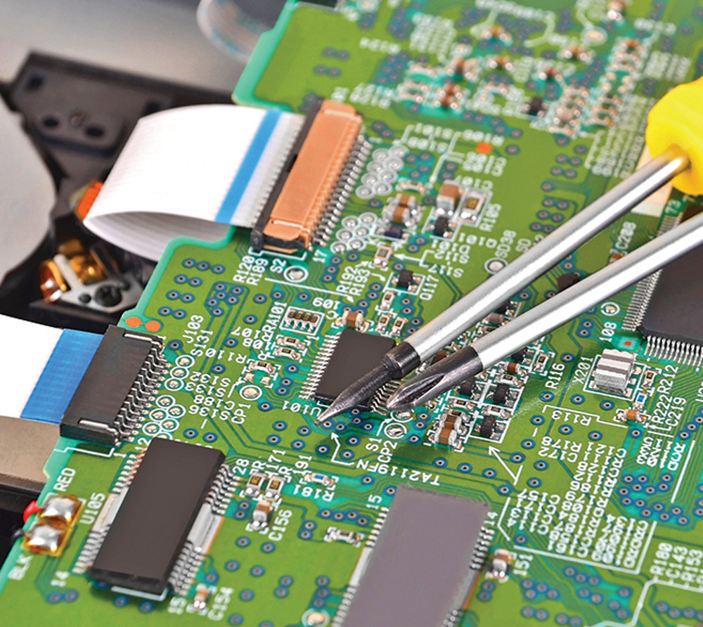 two screwdrivers on top of microchip