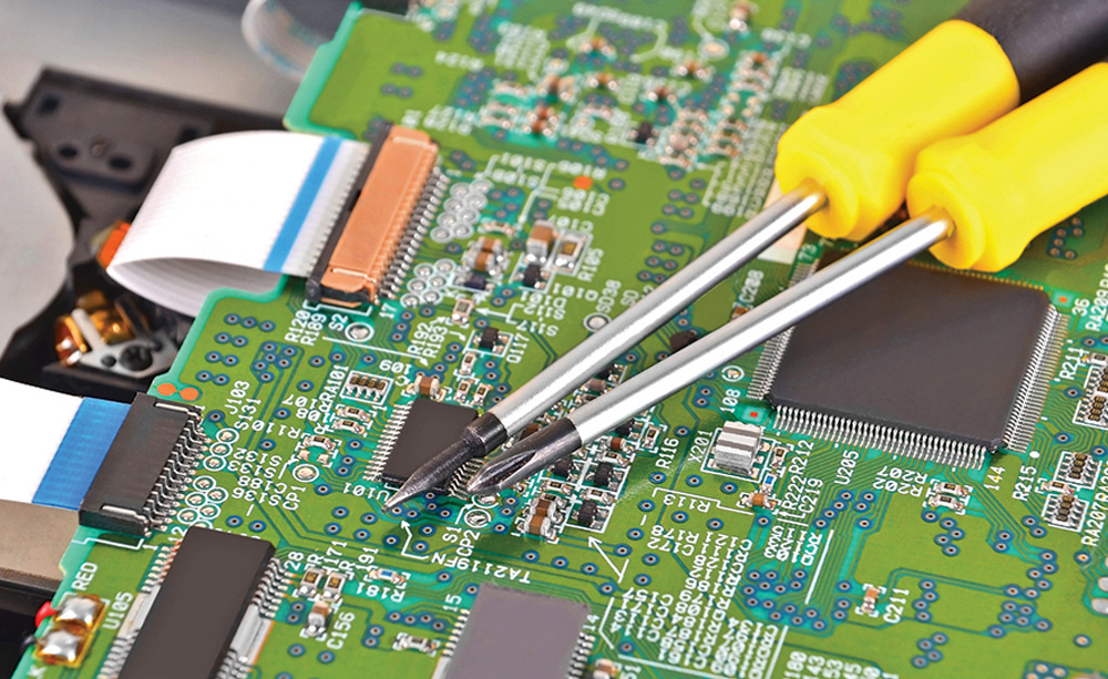 two screwdrivers on top of microchip