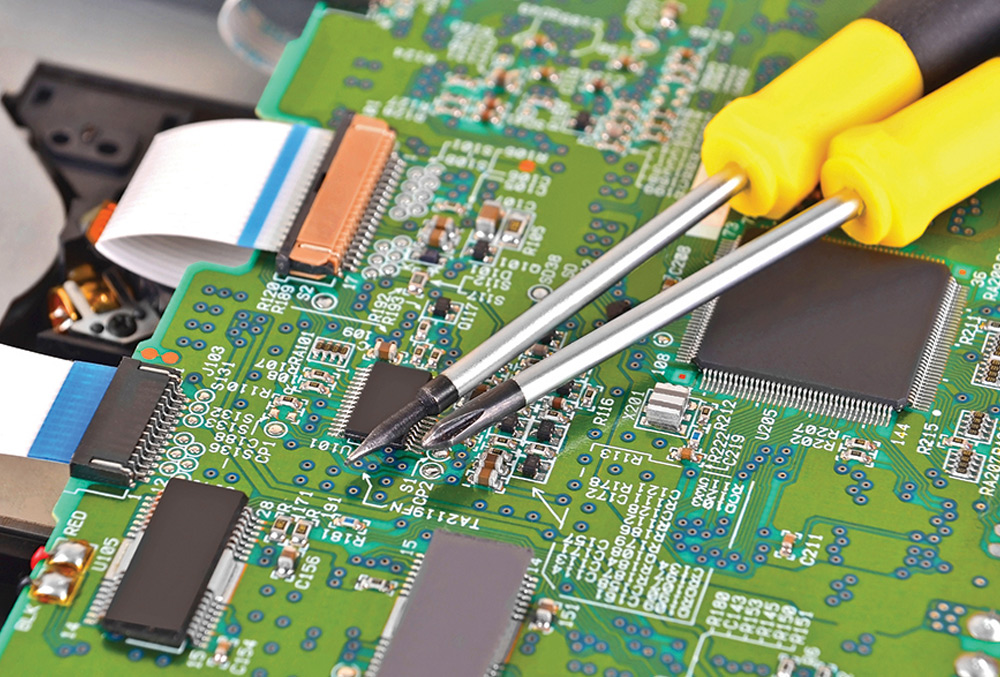 two screwdrivers on top of microchip