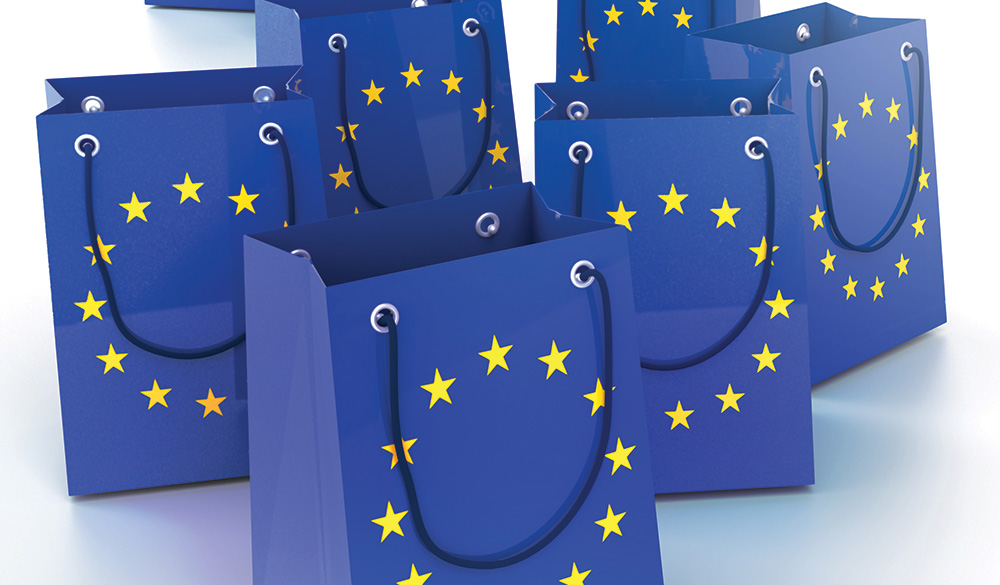 Multiple blue gift bags with the EU flag's ring of stars on the front