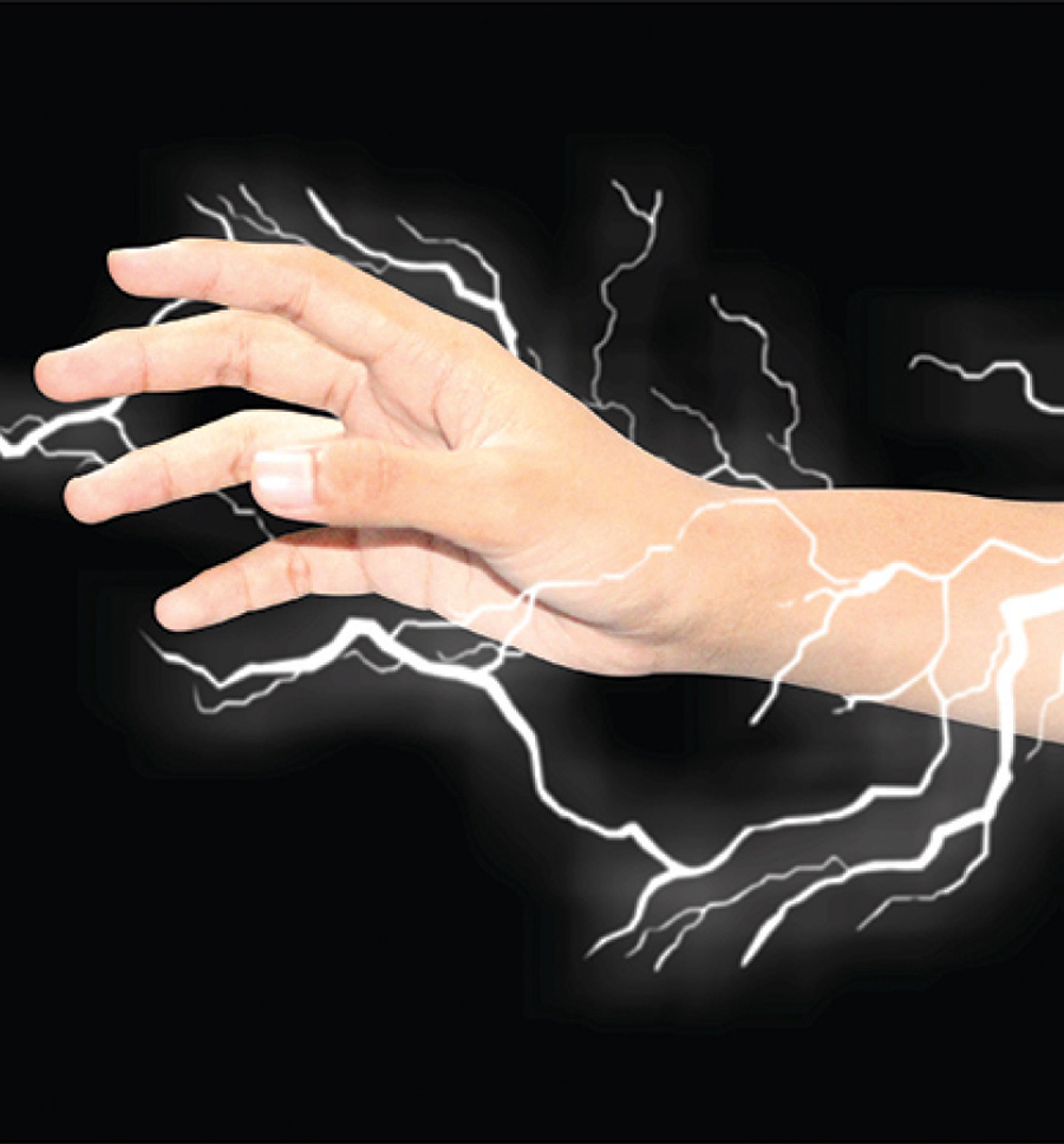 hand surrounded by electricity