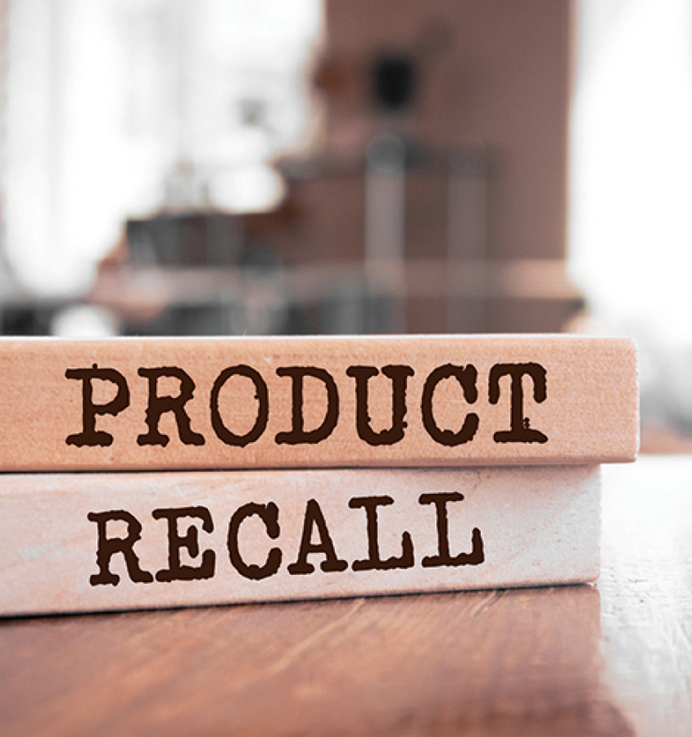 two wooden blocks labeled PRODUCT and RECALL