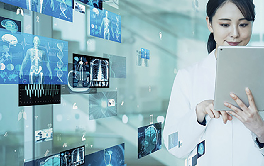 researcher looking at tablet with x-rays in the background