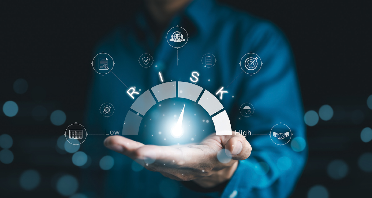  A close-up shot shows a person's outstretched hand holding a glowing, holographic dial that measures "RISK" on a spectrum from "Low" to "High." The needle on the dial points towards the middle, suggesting a moderate level of risk.