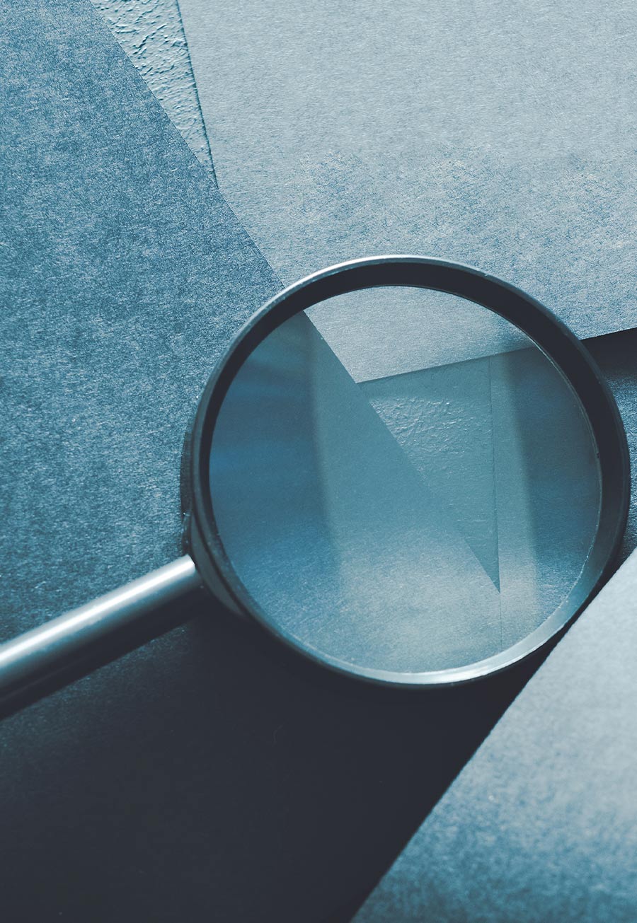 close up of a magnifying glass on a pile of ESD flooring materials
