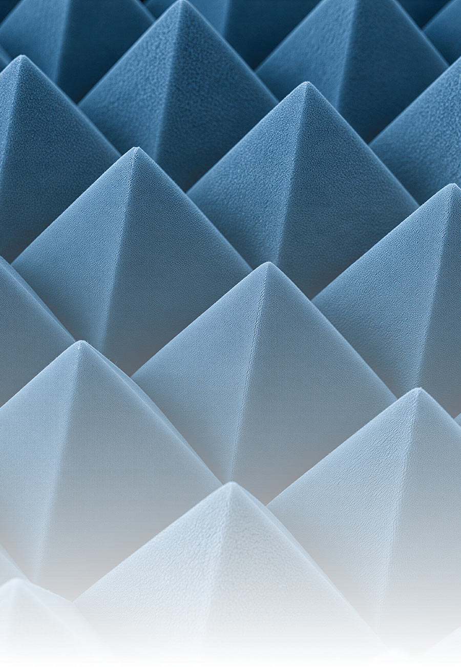 Close-up of blue, pyramid-shaped acoustic foam absorber panels.