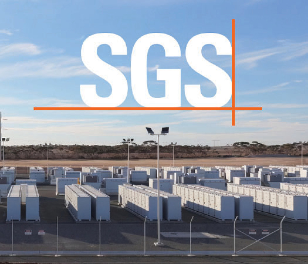 Large outdoor array of industrial energy storage containers under a blue sky with SGS logo.